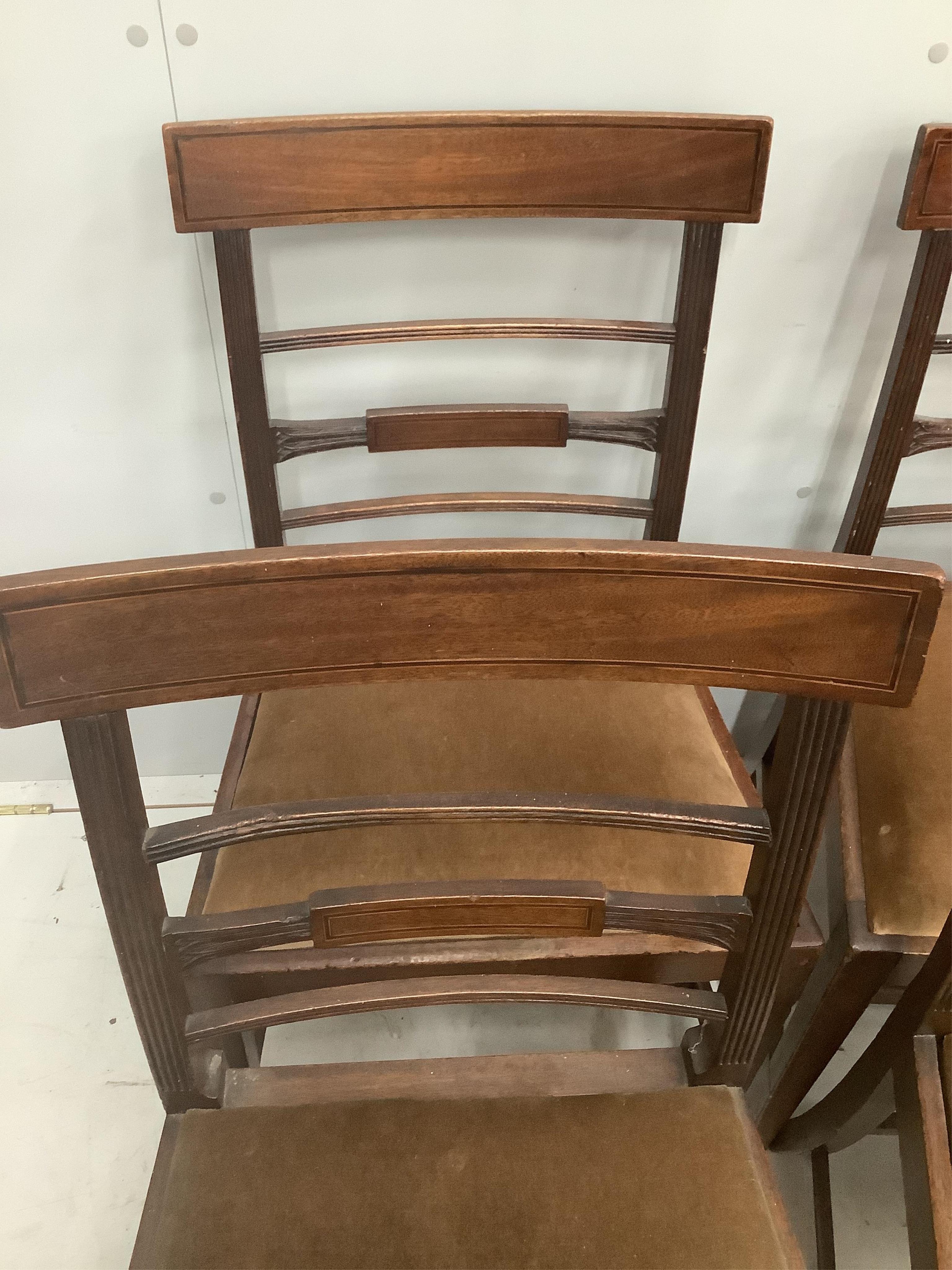 A set of six George III inlaid mahogany dining chairs. Condition - fair, drop in seats poor